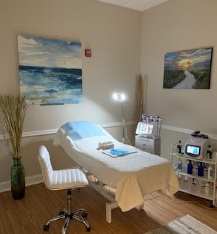 A female doctor confidently sits at her desk, ready for consultation in a medical office.
